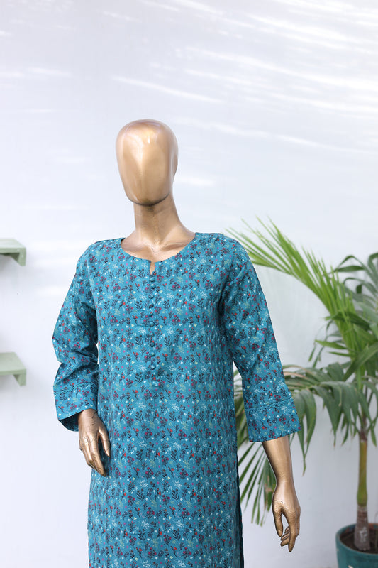 Mannequin wearing a blue patterned dress with a white background