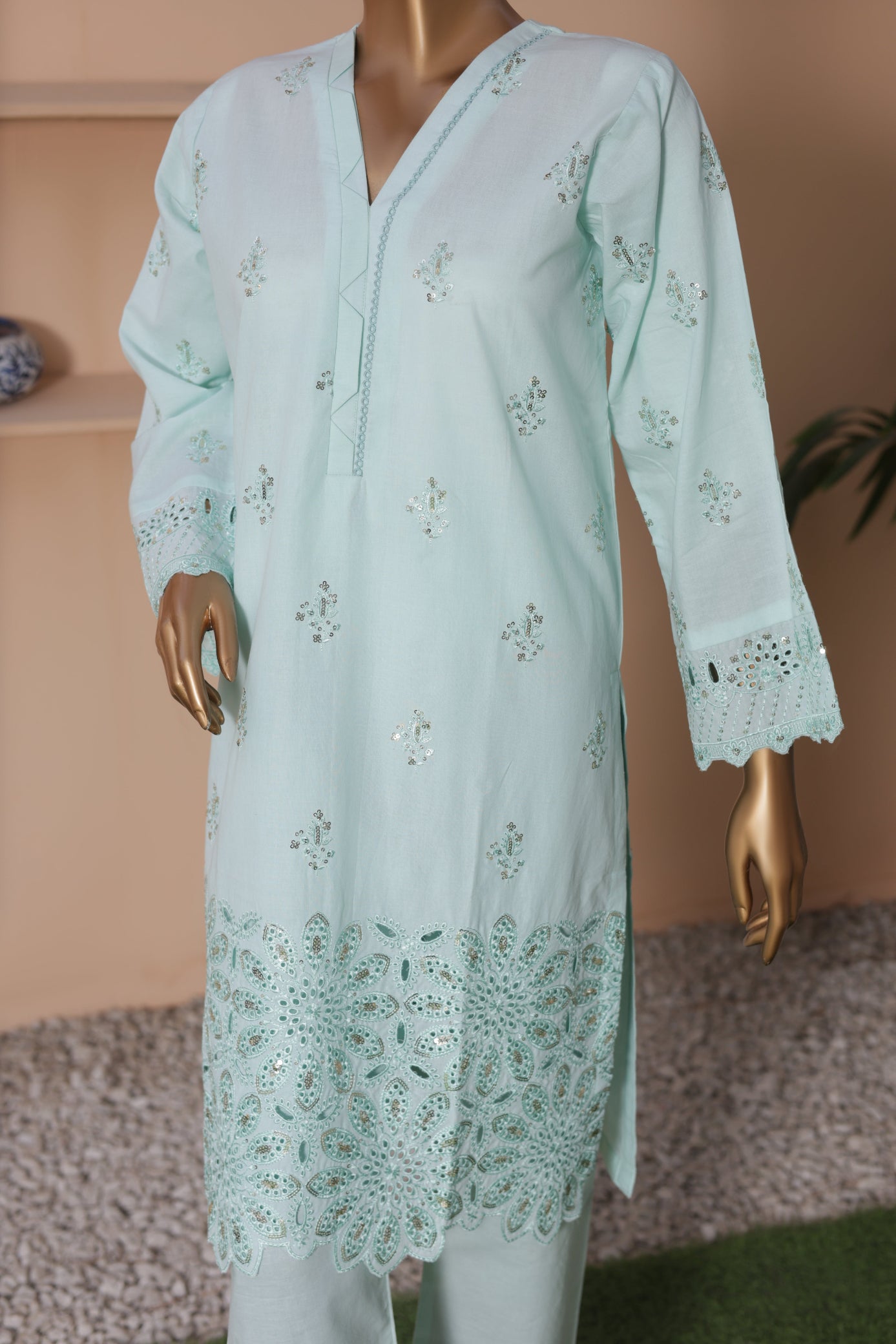 Light blue embroidered kurta on a mannequin against a neutral background