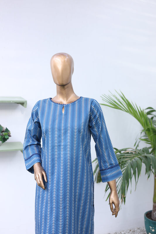 Mannequin wearing a blue and white patterned dress with a white background