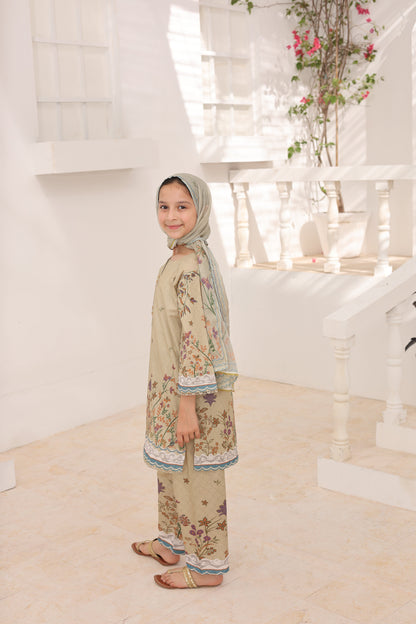 Woman in a floral dress and hijab standing in a room with a mirror and decorative plants.