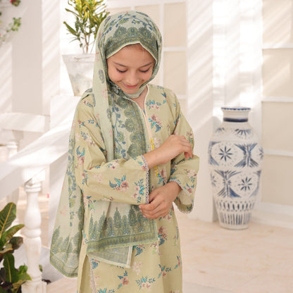 Woman in a floral dress and headscarf holding a bottle with a white background