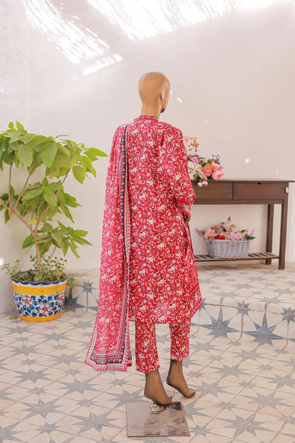 Mannequin wearing a red floral outfit with a matching dupatta in a room with decorative elements.