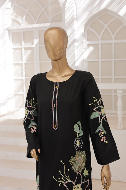 Black embroidered garment on a mannequin against a neutral background