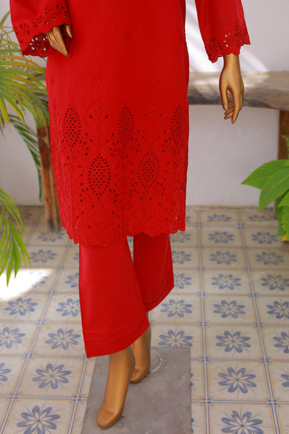 Red embroidered outfit on a mannequin against a tiled floor background