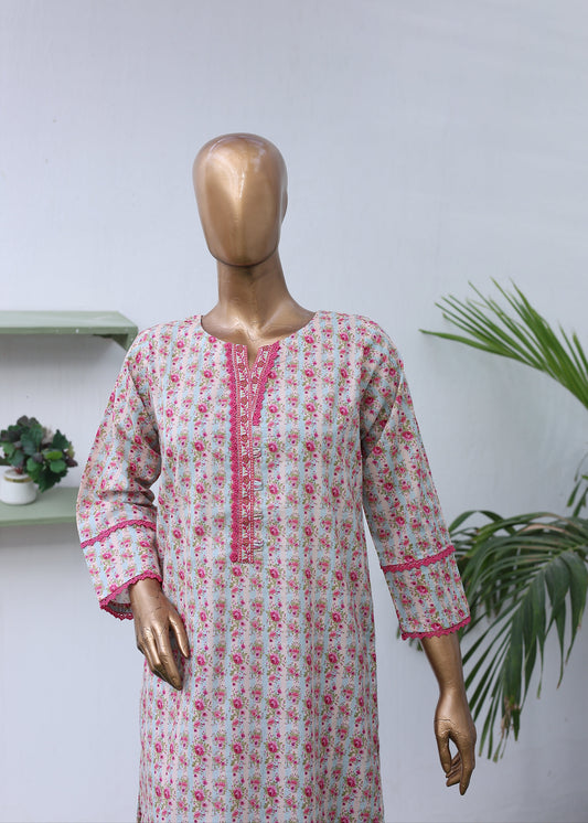 Mannequin wearing a floral dress with pink accents on a white background