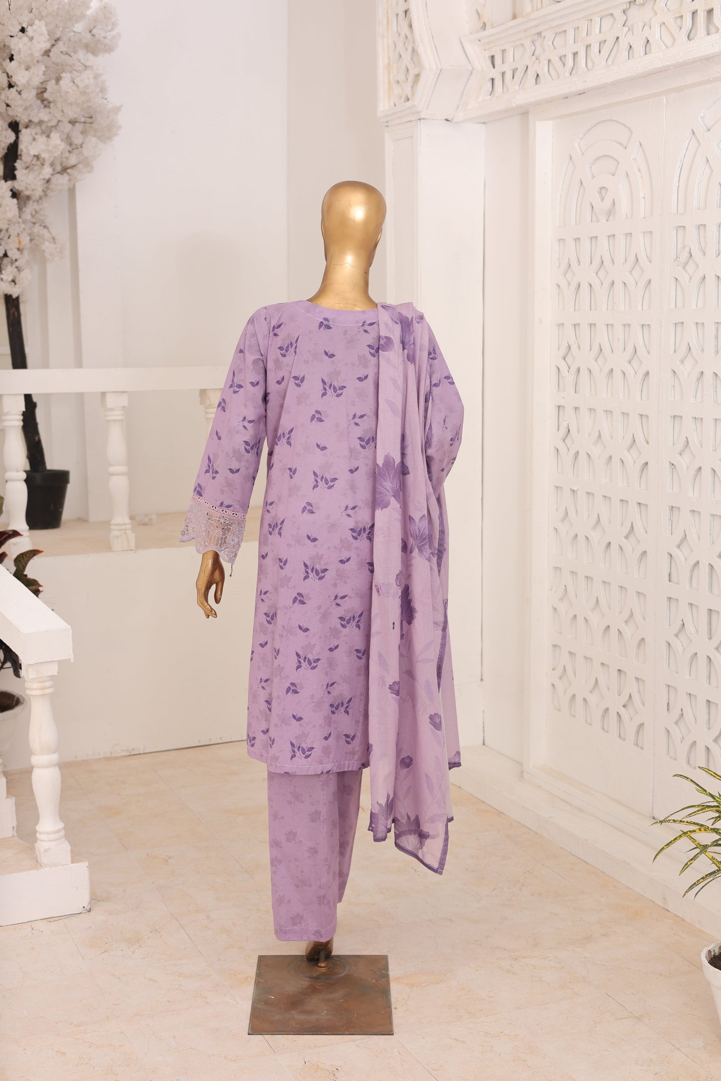 Purple floral dress on a mannequin against a neutral background