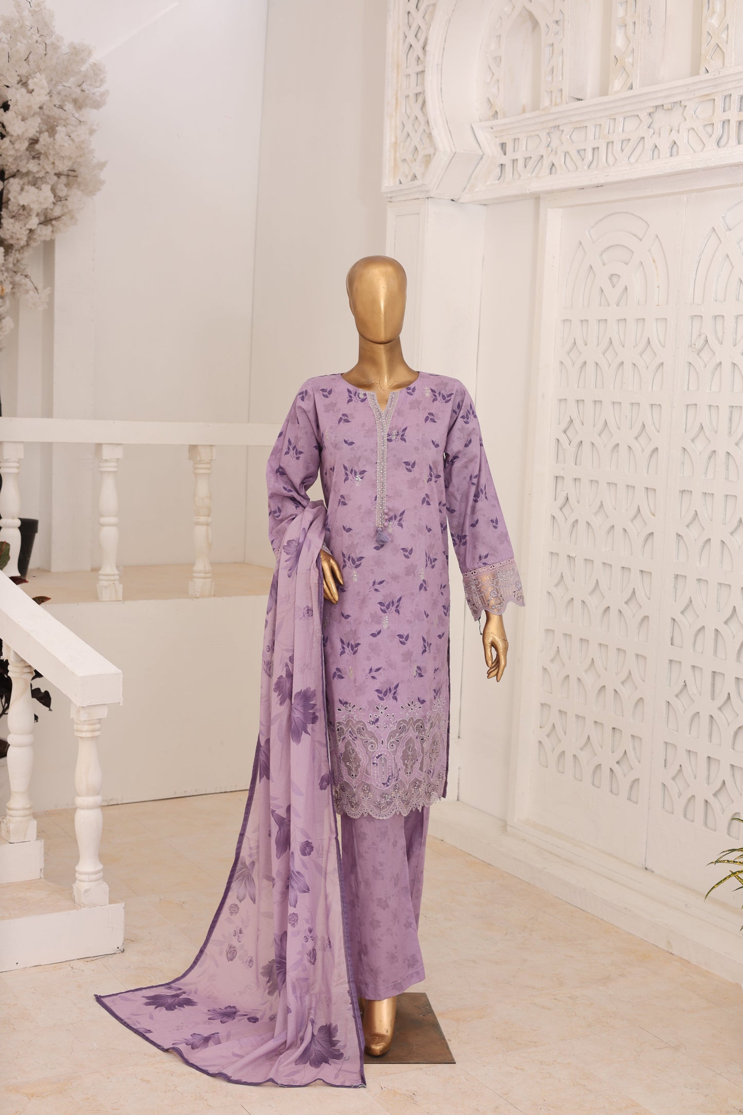 Purple floral dress on a mannequin against a white background